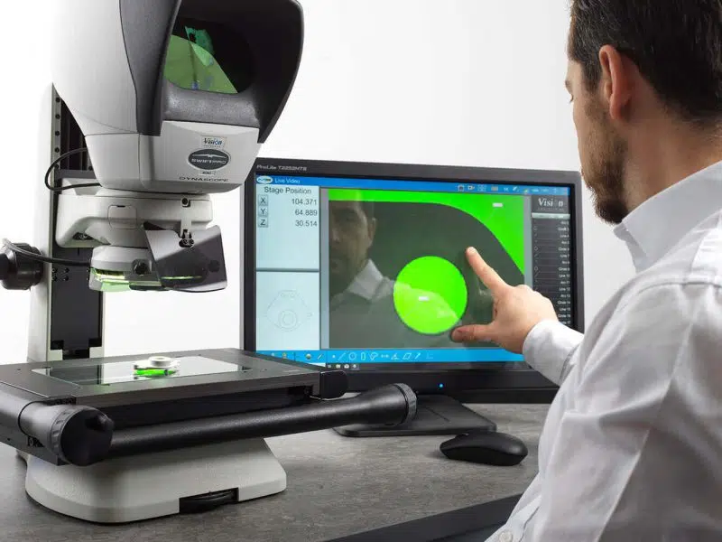 Operator using the Swift Pro measuring microscope