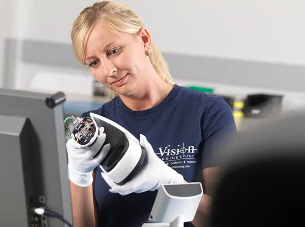 7.Turning-Your-Ideas-Into-Reality-VEMOS-production-worker-feature-image-600×447 woman checking product assembly in manufacturing facility